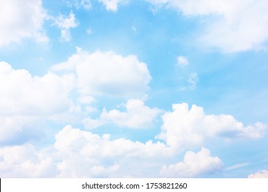 Light blue sky with white heap clouds - Summer cloudscape,  may be used as background