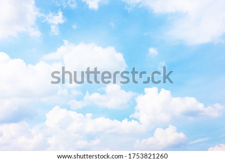 Light blue sky with white heap clouds - Summer cloudscape,  may be used as background
