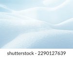 LIGHT BLUE SNOW BACKGROUND, NATURAL CHRISTMAS BACKDROP WITH SNOWY HILLS IN SUN LIGHT