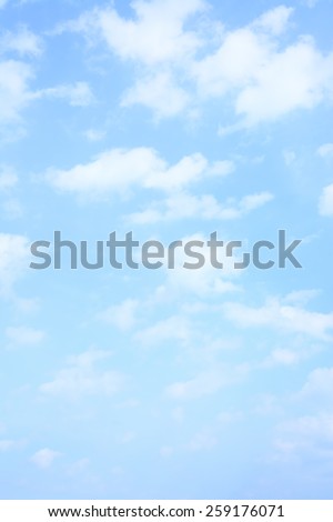 Light blue spring sky with clouds, may be used as background