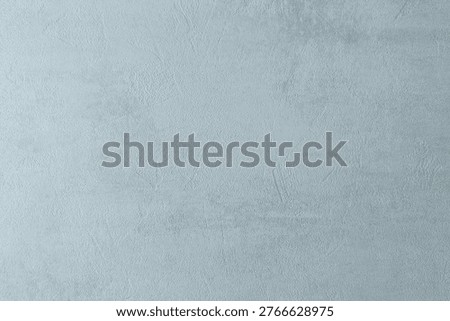 Light blue textured surface with subtle patterns suitable for various design projects