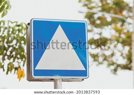 Light blue and white label board for sign on sunlight in the public park, Copy space for advertising and announce concept.