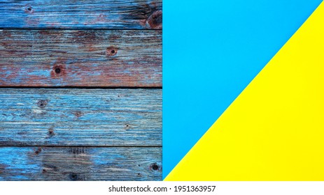 Light Blue Yellow Cardstock On A Rustic Table Constructed From Aged Wooden Planks. Abstract Background.