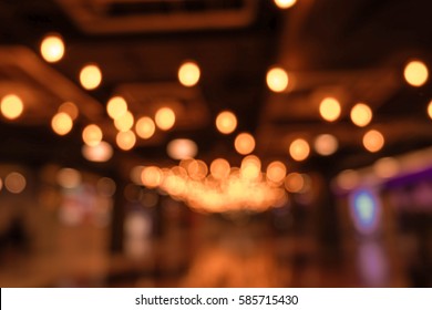 light blur background with bokeh in the shopping mall, dark blurred background