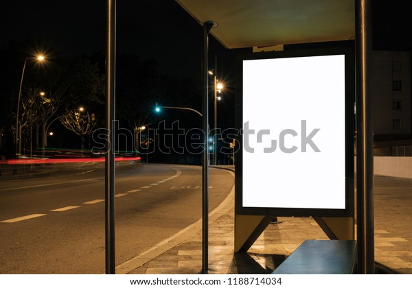 Light box with\
white blank space for ads at bus stop. Night street marketing\
concept. Horizontal\
mock-up