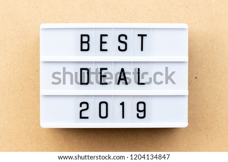 Light box with word best deal 2019 on wood background