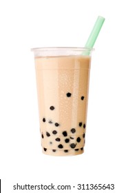 Light Brown Creamy Bubble Tea With Milk And Black Tapioca With A Green Straw In A Transparent Cup Isolated On White