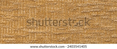 Light brown fluffy background of soft, fleecy cloth. Texture of textile closeup