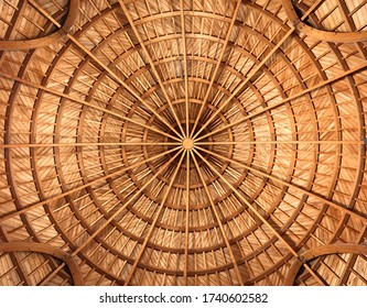 Light brown golden wooden thatched ceiling circular symmetrical pattern