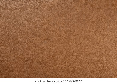 Light brown leather as background, top view