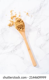 Light Brown Sugar On A Marble Counter Top.