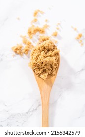 Light Brown Sugar On A Marble Counter Top.