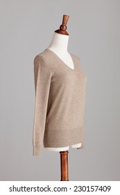 Light Brown Woman Cashmere Sweater With Wood Model On Grey Isolated