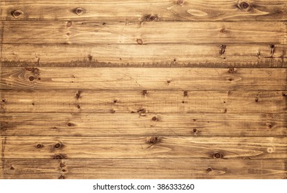 Light Brown Wood Texture Background Viewed From Above. The Wooden Planks Are Stacked Horizontally And Have A Worn Look. This Surface Would Be Great As Design Element For A Wall, Floor, Table Etc.