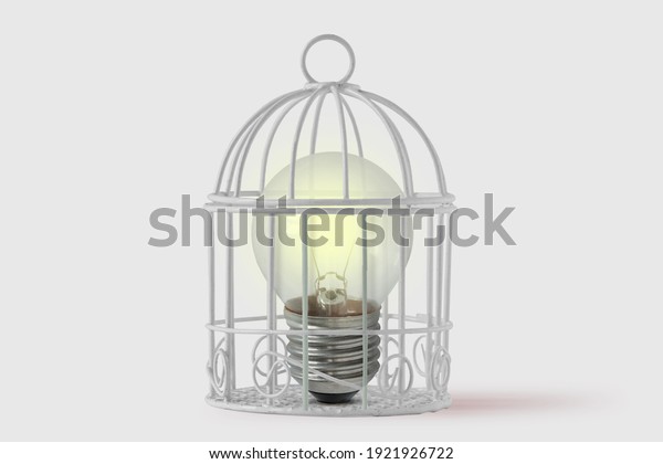 Light bulb in bird cage on white background -\
Concept of mind and\
freedom