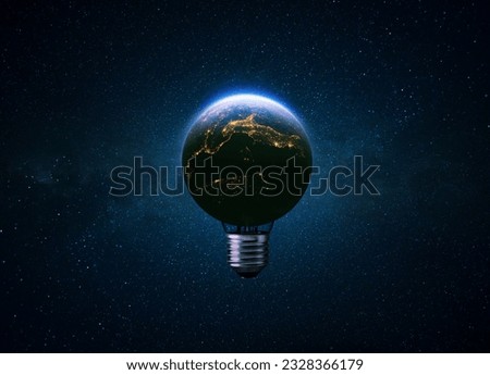Light bulb blue planet Earth with glow of night cities in space. Electrification, creative idea. Earth energy and global warming. Eco energy