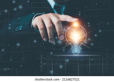 Light bulb with brain inside the hands of the businessman and point connecting network on blue background. Creative The brain in the light bulb, The concept of the business idea. - Shutterstock ID 2116827521