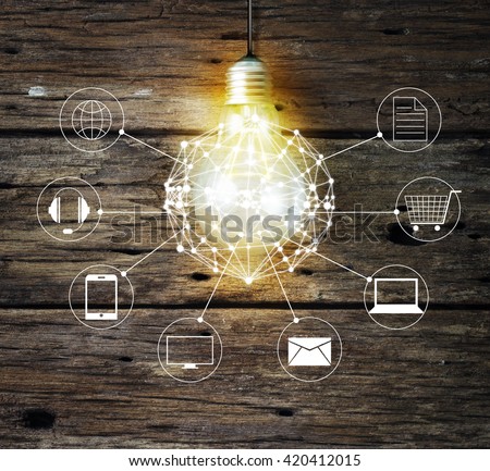 Light bulb circle global and icon customer network connection on wooden background, Omni Channel 
