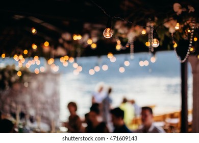 Light Bulb Filament At Party With Bokeh Background