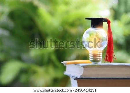 light bulb and graduation cap. Idea of education, technology