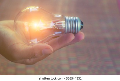Light bulb in hand 
