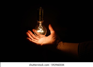 Light Bulb And Hand, Concept Of Wisdom.