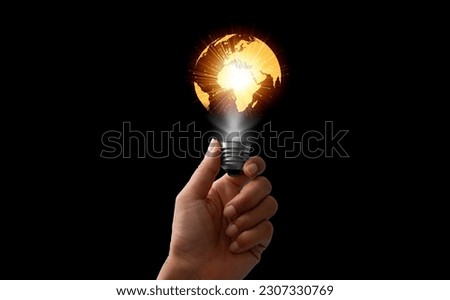 Light bulb in hand of map wearing suit in black background. Ideas for Success and new idea or inspiration with Innovation , technology based on data from the Internet, big data.