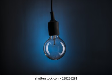 Light Bulb Hanging From Ceiling.