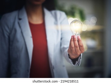 Light Bulb, Innovation And Bright Idea With Vision, Strategy And Growth Mindset For Startup. Closeup Hand Of Leading, Thinking And Motivated Business Woman Holding Lightbulb And Showing Knowledge