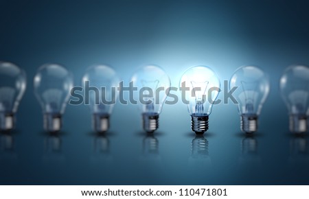 Light bulb lamps on a colour background