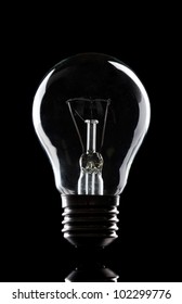 Light Bulb On Black Background