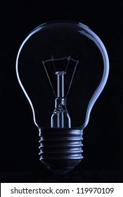 Light Bulb On Black Background