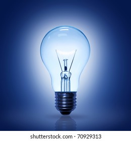 Light Bulb On Blue Background.