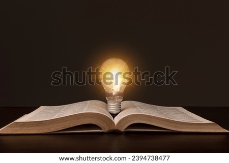 light bulb on book understanding of something Know the idea about inspiration from reading. concept concept innovation knowledge, learning or education and business study concepts