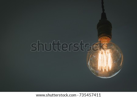 Light bulb on dark background, Concept of creativity.