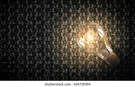 Light bulb on material surface - Shutterstock ID 434739394