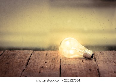 Light Bulb  On Wood Table