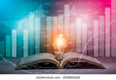 Light Bulb And Opened Vintage Book Style Vintage Dark Background Concept And Stock Market Or Forex Trading Graph And Candlestick Chart Suitable For Financial Investment Money, Currency Exchange.