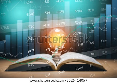 Light bulb and opened vintage book style vintage dark background concept and Stock market or forex trading graph and candlestick chart suitable for financial investment money, currency exchange.