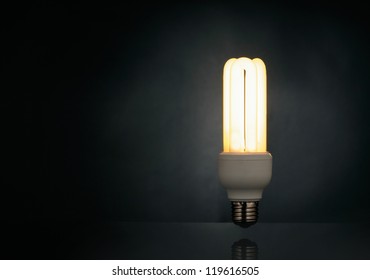 Light bulb over black background - Powered by Shutterstock