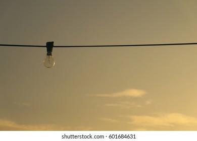 A light bulb over sunset