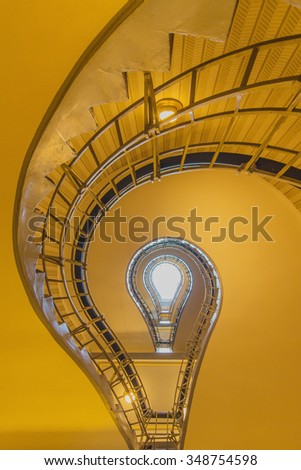 light bulb shaped cubism staircase in historical building in the centre of old Prague in black and white. Czech.