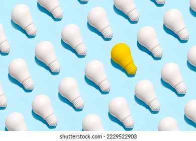 light bulb success business ideas creativity and inspiration concepts on blue background. Goal achievements flat lay minimalist composition - Shutterstock ID 2229522903