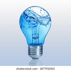 Light Bulb With Water Splashes On Light Background. Alternative Energy Source