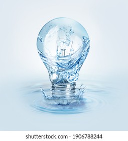 Light Bulb With Water Splashes On Light Background. Alternative Energy Source