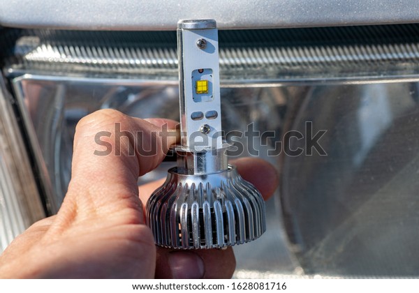 Light bulbs for\
car lamps. Automotive part in Silvery metallic and black color with\
wires and connecting\
elements