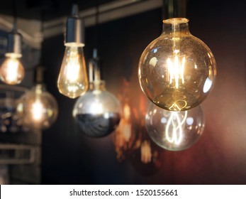 Light bulbs on a black background. Lights on. Light design. Idea concept 