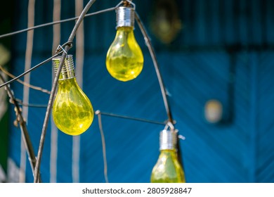 Light bulbs on the ceiling of the cafe in close-up.