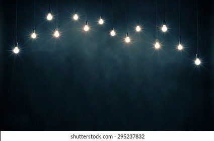 Light Bulbs On Dark Blue Background