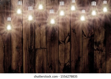 Light Bulbs On Dark Wooden Background Stock Photo 1556278835 | Shutterstock